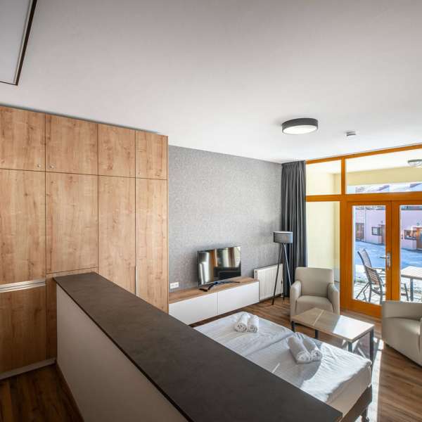 Obývací pokoj studiového apartmánu 2S1