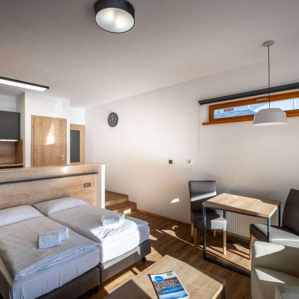 Obývací pokoj studiového apartmánu 2S1